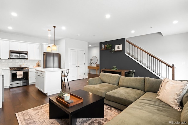 living room featuring dark wood-type flooring