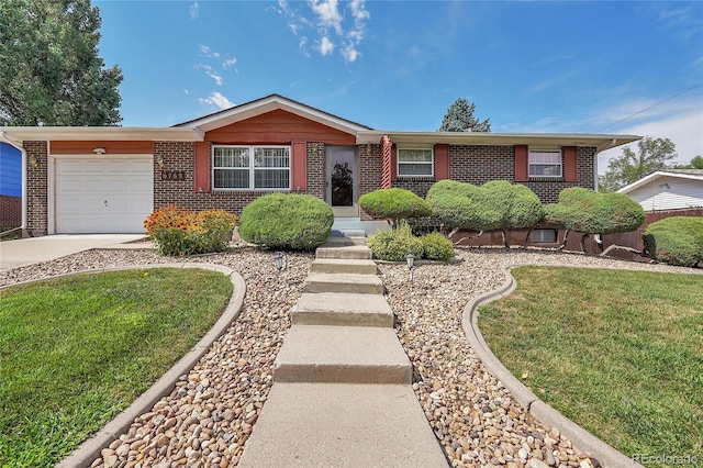 single story home featuring a garage and a front lawn