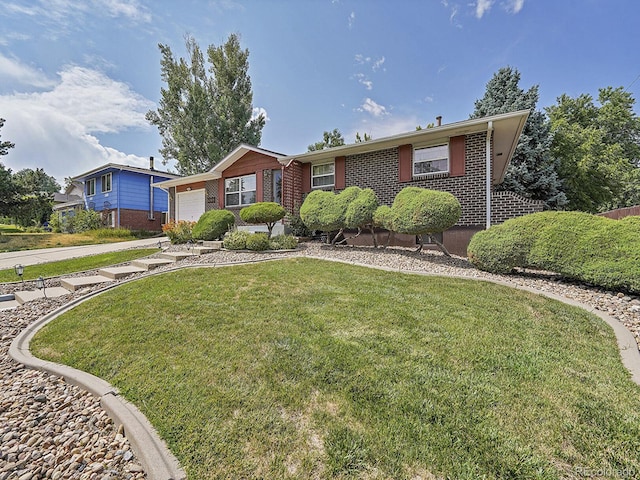 6769 W 70th Ave, Arvada, CO 80003 - ranch-style home featuring an attached garage, brick siding, and a front lawn