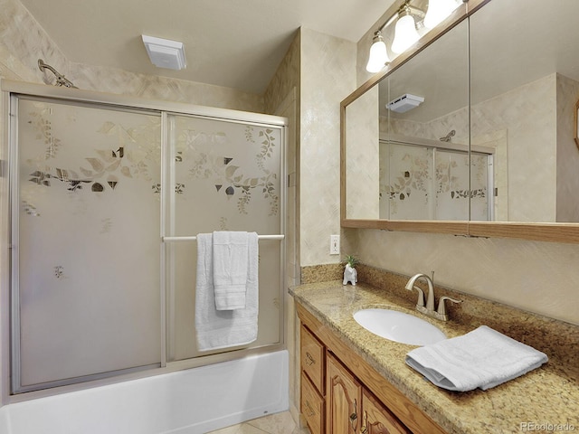 6769 W 70th Ave, Arvada, CO 80003 - bathroom featuring shower / bath combination with glass door and vanity