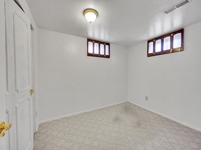 6769 W 70th Ave, Arvada, CO 80003 - below grade area with carpet floors, healthy amount of natural light, and baseboards