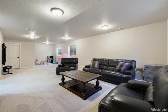 living room featuring light carpet and a textured ceiling