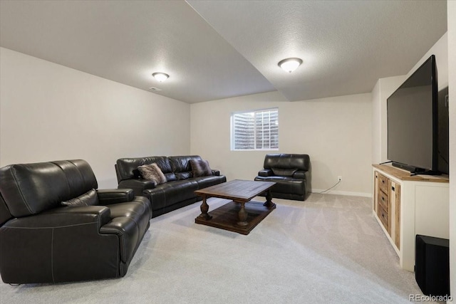 living room featuring light colored carpet and a textured ceiling