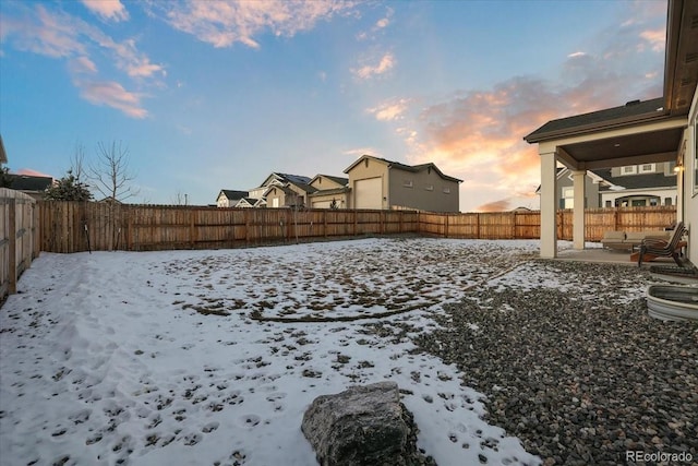 view of yard covered in snow