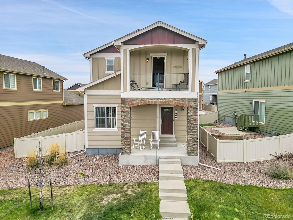 view of front of property with a balcony