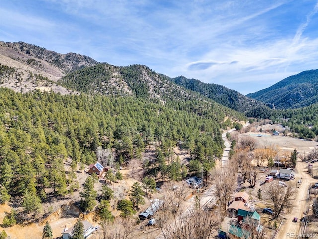 property view of mountains featuring a view of trees