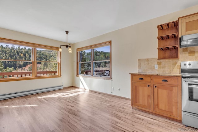 unfurnished dining area with a baseboard radiator, baseboards, and light wood finished floors