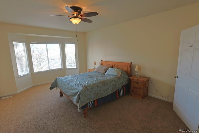 bedroom with ceiling fan and carpet floors