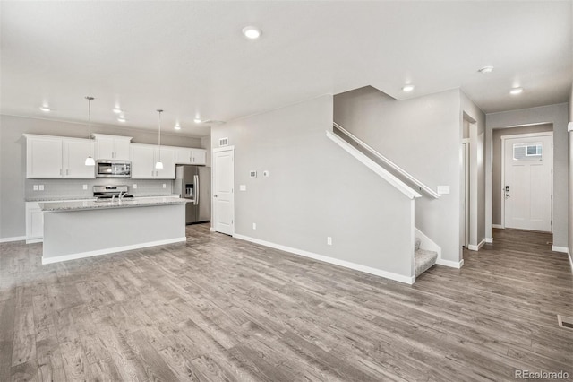 unfurnished living room featuring light hardwood / wood-style flooring