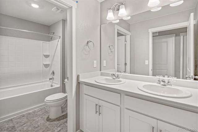 full bathroom featuring shower / tub combination, vanity, and toilet