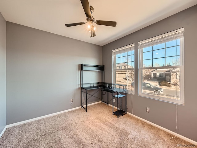 unfurnished office with light colored carpet and ceiling fan