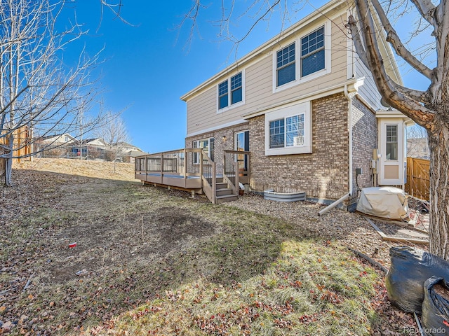 rear view of property with a deck