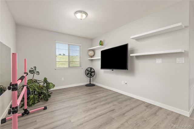 16486 W 94th Dr, Arvada, CO 80007 - exercise area featuring wood finished floors and baseboards