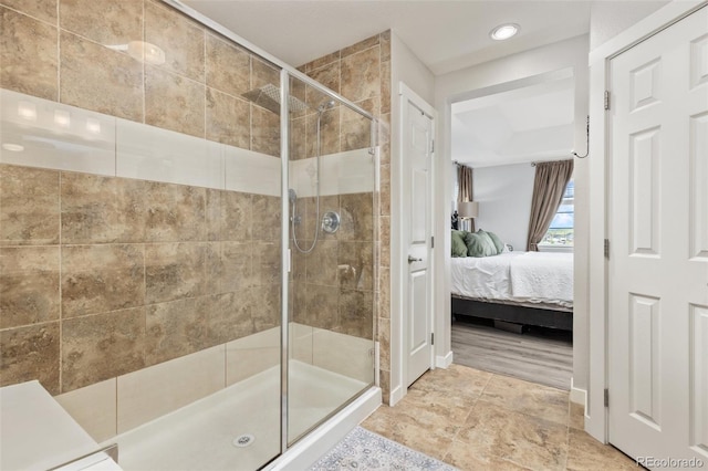 16486 W 94th Dr, Arvada, CO 80007 - full bathroom featuring connected bathroom, a stall shower, and recessed lighting