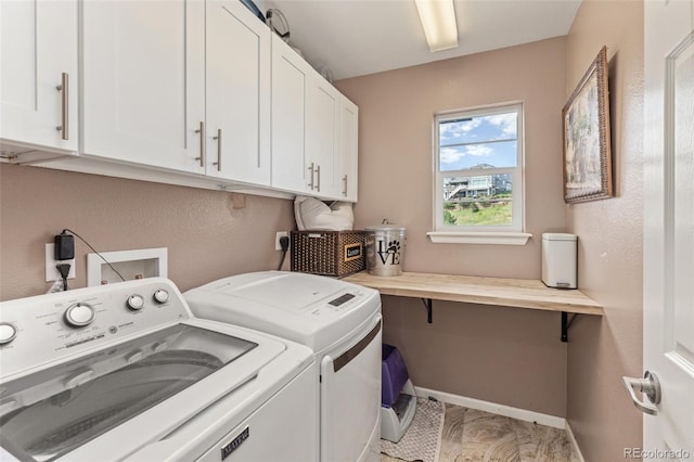 16486 W 94th Dr, Arvada, CO 80007 - laundry area with cabinet space and independent washer and dryer