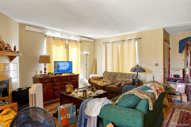 2480 Allegheny Dr, Colorado Springs, CO 80919 - living room featuring wood finished floors and a textured ceiling