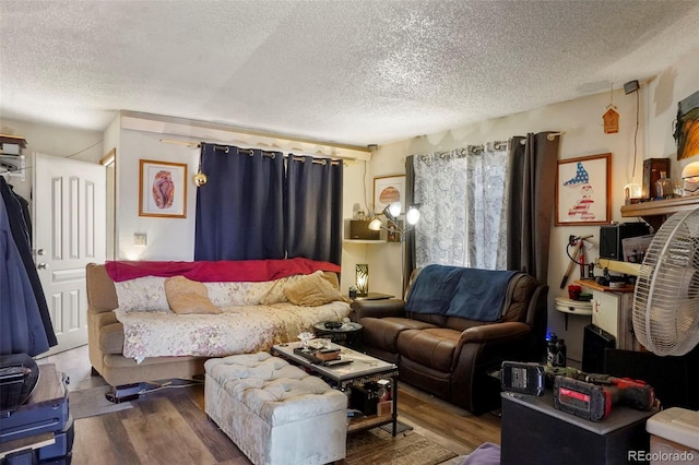 2480 Allegheny Dr, Colorado Springs, CO 80919 - living room featuring a textured ceiling and wood finished floors