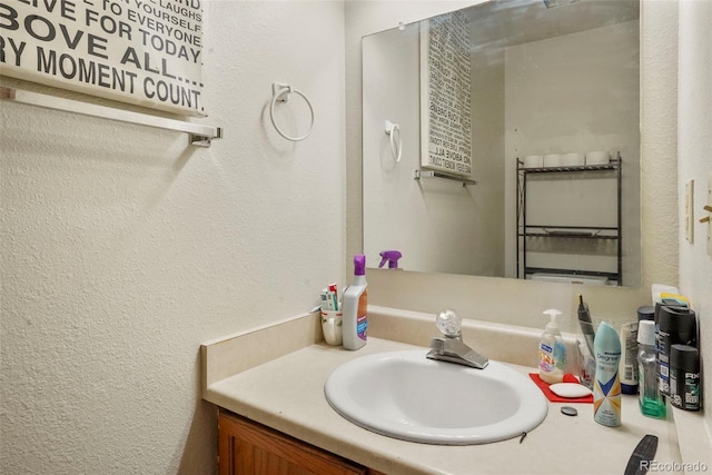 2480 Allegheny Dr, Colorado Springs, CO 80919 - bathroom featuring vanity and a textured wall