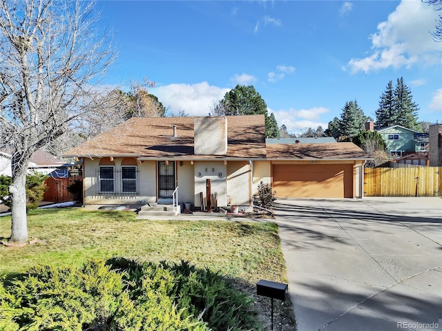 ranch-style home featuring a front yard and a garage