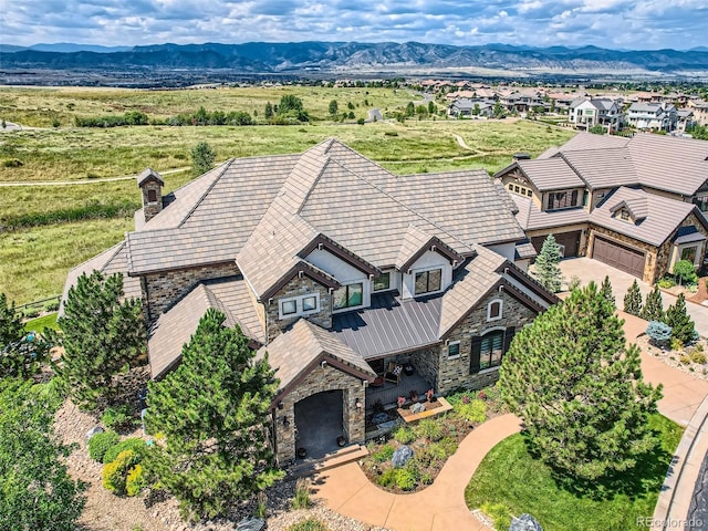 birds eye view of property with a mountain view