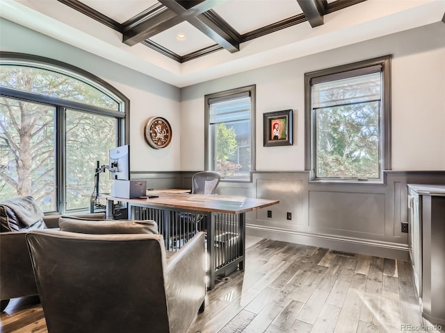 office space featuring coffered ceiling, beam ceiling, wood-type flooring, and ornamental molding