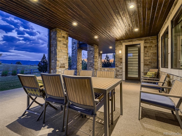 patio terrace at dusk with a mountain view