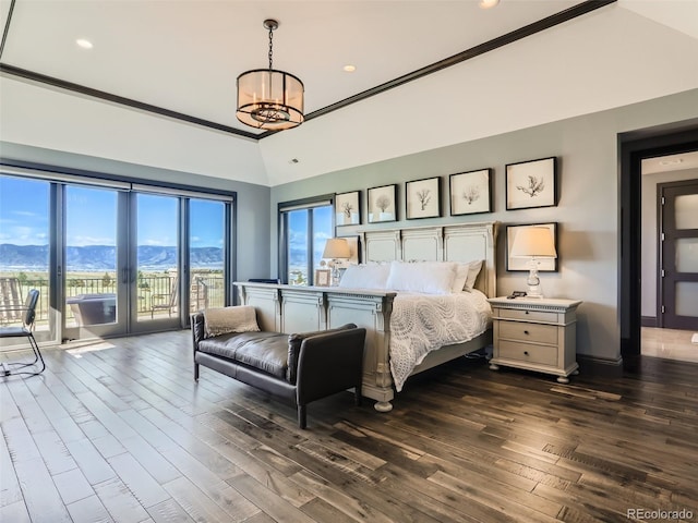 bedroom with a chandelier, ornamental molding, access to exterior, a mountain view, and dark wood-type flooring