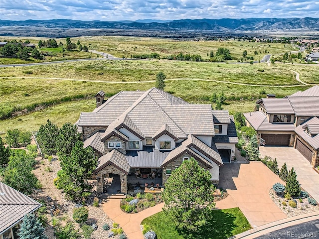 birds eye view of property with a mountain view