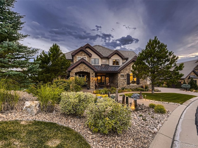 craftsman-style home featuring a yard