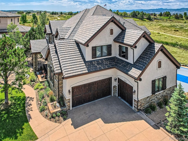 view of front of house with a garage and a mountain view