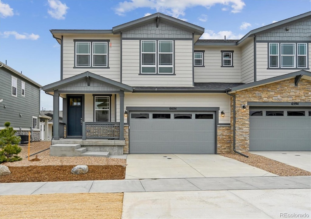 craftsman-style home with a garage