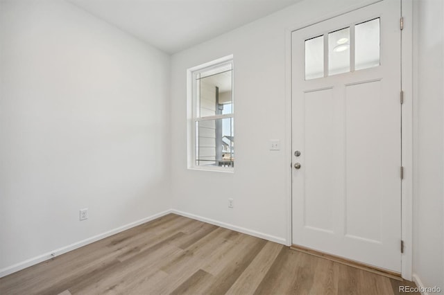 entryway with light hardwood / wood-style floors