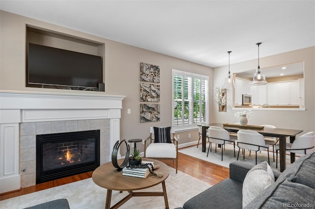 7746 E Severn Pl, Denver, CO 80230 - living area featuring wood finished floors, a fireplace, and recessed lighting