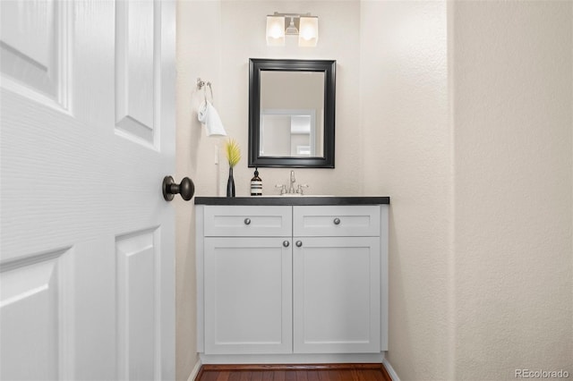 7746 E Severn Pl, Denver, CO 80230 - bathroom with vanity and wood finished floors