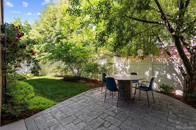 7746 E Severn Pl, Denver, CO 80230 - fenced backyard with a patio area and outdoor dining space