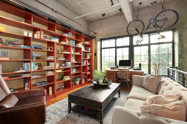 2000 Little Raven St Unit 1B, Denver, CO 80202 - living area with a towering ceiling, wood finished floors, and an office area