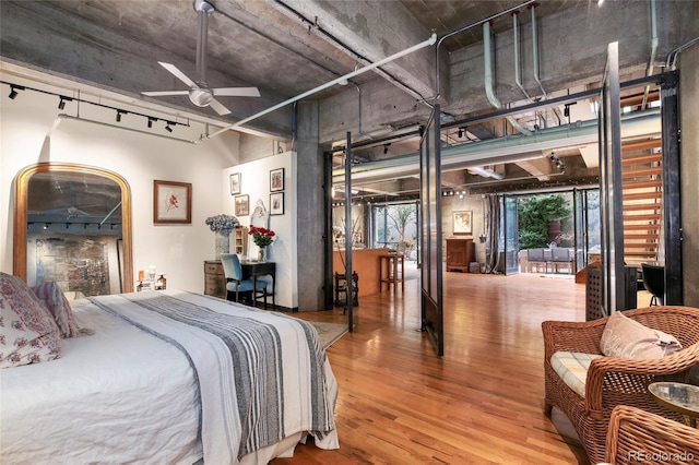 2000 Little Raven St Unit 1B, Denver, CO 80202 - bedroom featuring wood finished floors and rail lighting