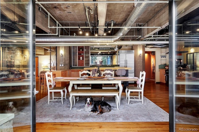 2000 Little Raven St Unit 1B, Denver, CO 80202 - dining space featuring wood finished floors