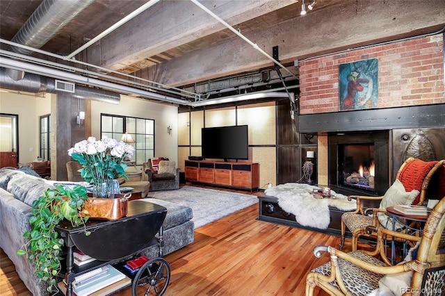 2000 Little Raven St Unit 1B, Denver, CO 80202 - living room featuring wood finished floors and a fireplace