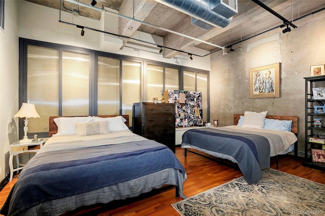 2000 Little Raven St Unit 1B, Denver, CO 80202 - bedroom with rail lighting and wood finished floors