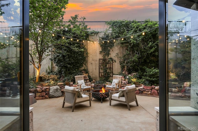 2000 Little Raven St Unit 1B, Denver, CO 80202 - patio terrace at dusk with an outdoor fire pit