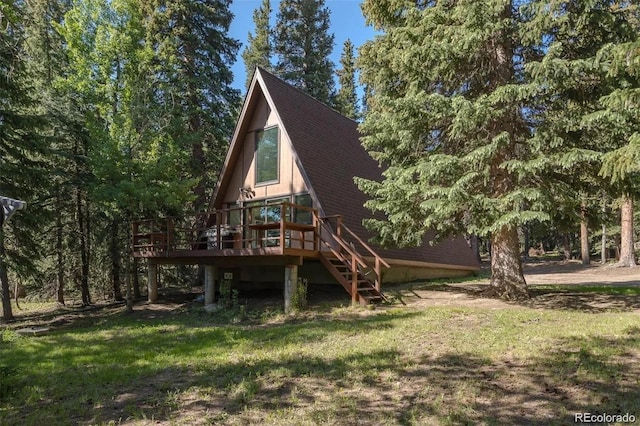 100 Aspen Ln, Evergreen, CO 80439 - view of jungle gym with a wooden deck, a yard, and stairway
