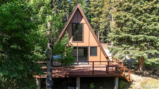 100 Aspen Ln, Evergreen, CO 80439 - view of side of property featuring a deck and a view of trees