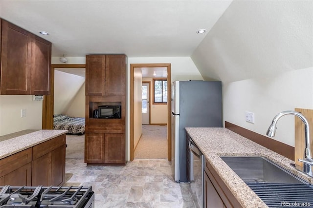 100 Aspen Ln, Evergreen, CO 80439 - kitchen with a sink, light colored carpet, stainless steel appliances, light stone countertops, and stone finish flooring