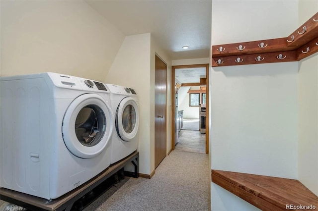 100 Aspen Ln, Evergreen, CO 80439 - laundry area featuring light colored carpet, washing machine and dryer, and recessed lighting