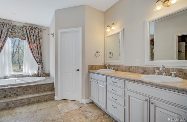 full bath with double vanity, decorative backsplash, and a sink