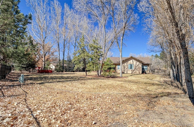 view of yard with fence