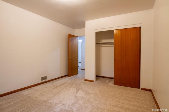 3222 Fenton St, Wheat Ridge, CO 80212 - unfurnished bedroom with light carpet, a closet, and baseboards