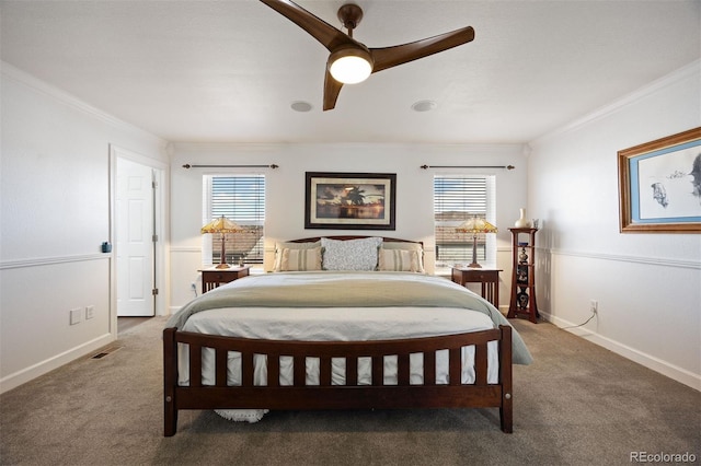 bedroom with carpet floors, ornamental molding, multiple windows, and visible vents