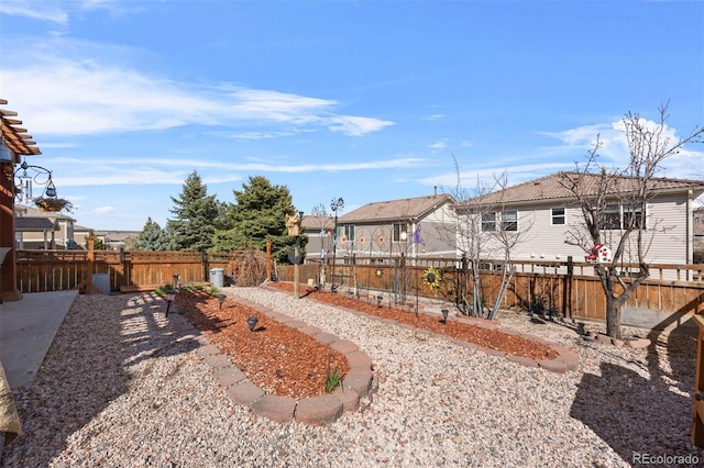 view of yard with fence and a residential view